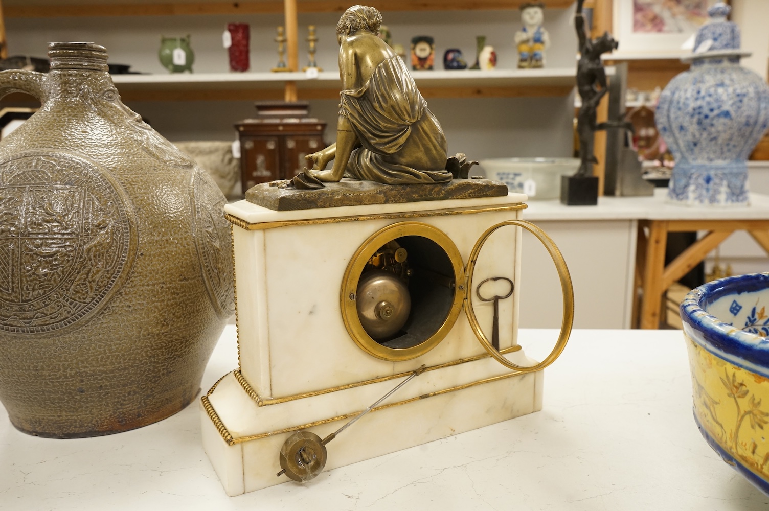 A late 19th century French bronze figural mounted marble mantel clock, 34cm